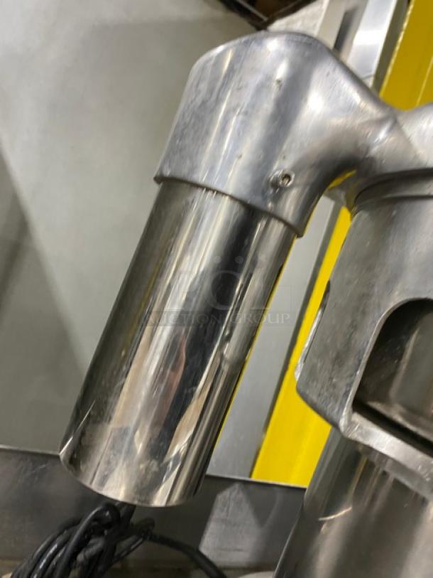 L&J WF-A2000 commercial stainless steel juice extractor, electric powered, 110V. Visible wear; ideal for countertops.