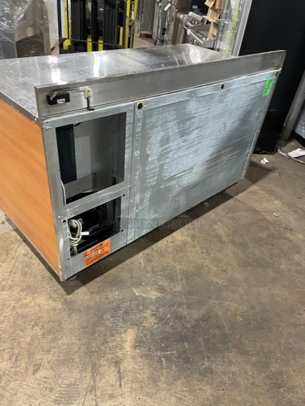 Duke Commercial Stainless Steel 2 Door 60" Worktop Refrigerator with up-turned backsplash, model RBC60M, 120V, on legs.