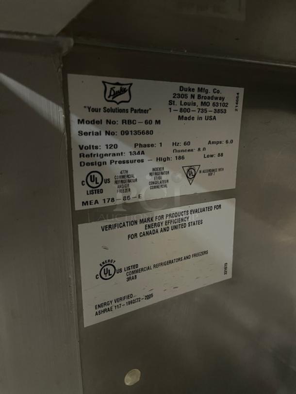 Duke Model RBC-60M stainless steel refrigerator label details, serial number 09135680, 120V, 1 phase, energy efficiency verified.