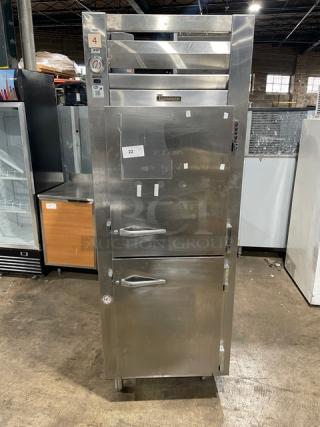 Traulsen stainless steel reach-in refrigerator/freezer combo, model RDT132WUT, with pan slide, chrome rack, and legs.