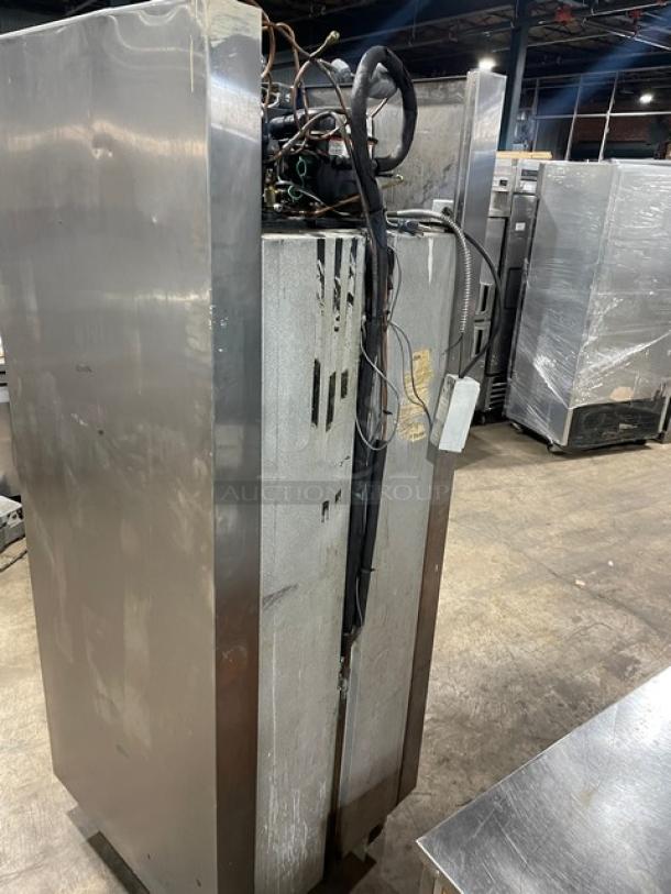 Traulsen stainless steel swing door refrigerator/freezer combo, model RDT1-32WUT, with pan slide and wired rack, on legs.