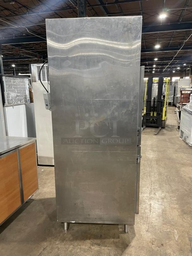 Traulsen stainless steel RDT1-32WUT refrigerator/freezer combo, solid swing door, built-in pan slide, chrome rack, on legs.