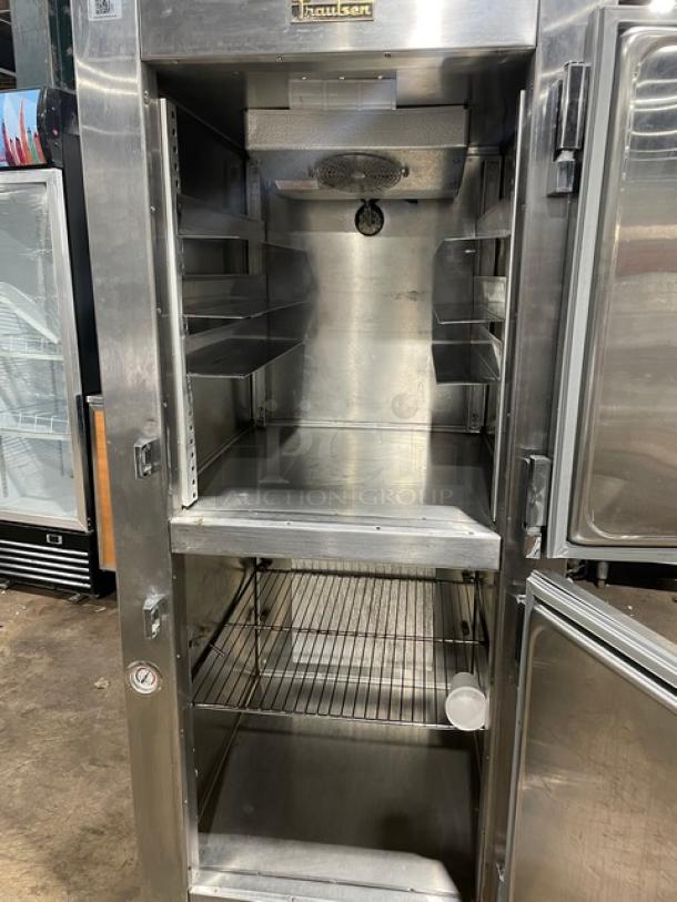 Traulsen stainless steel reach-in refrigerator/freezer combo, model RDT1-32WUT, with pan slide and chrome rack, on legs.