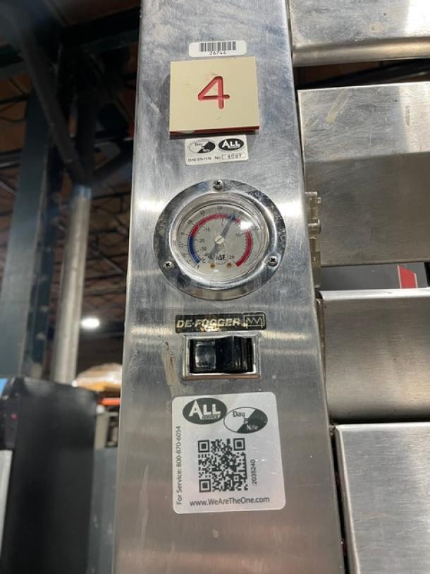 Traulsen RDT1-32WUT commercial refrigerator/freezer combo with built-in pan slide, chrome-plated rack, and defogger switch.