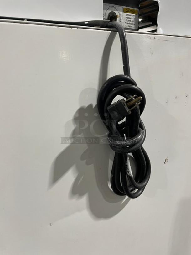 Leer Commercial Ice Merchandiser Freezer, Model 301UC25MG, 115V, with white exterior, coiled power cord visible.