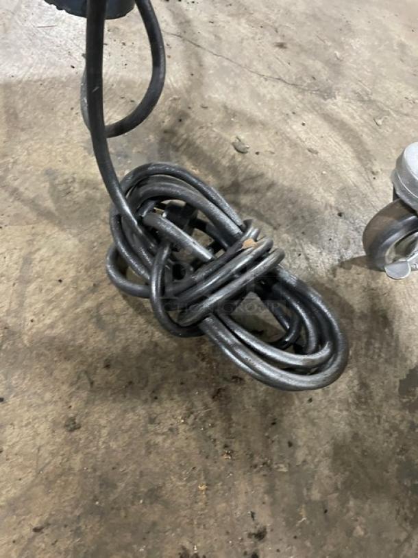 Delfield Salad Ace Series electric-powered 20-gal salad dryer, model SALD1, stainless steel, on casters, shown on concrete floor.