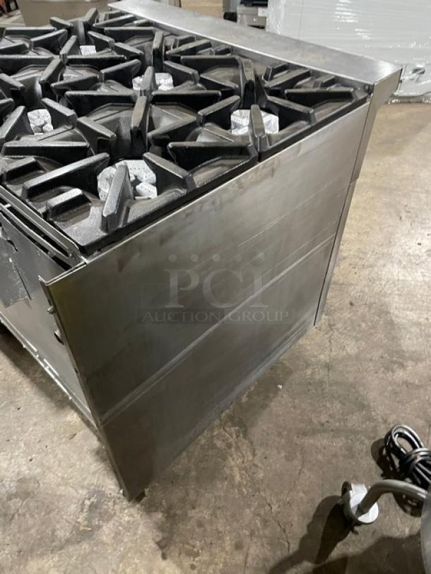 U.S. Range commercial stainless steel 6-burner gas range with enclosed dry cabinet base and casters. Excellent condition.