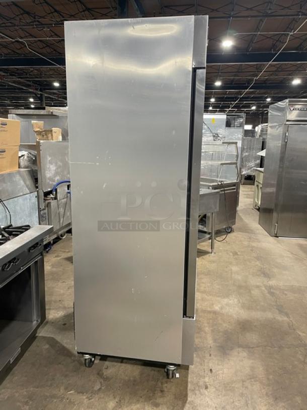 True Commercial Stainless Steel 2 Door Reach-In Refrigerator, Model T-35-HC, with poly-coated wired rack, on casters.