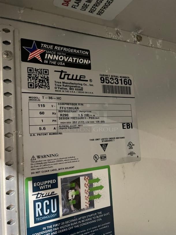 True T-35-HC stainless steel 2-door commercial refrigerator, model T35HC, SN 9533160, 115V 1 phase, with poly-coated racks, on casters.