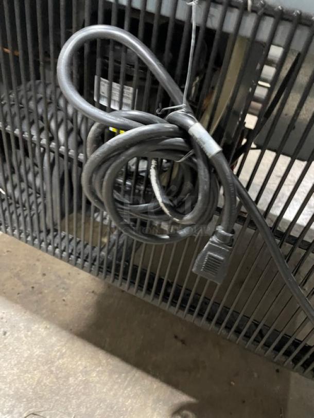 True T35HC commercial refrigerator rear view with power cord and vent. Model T-35-HC, SN 9533160, 115V, on casters.