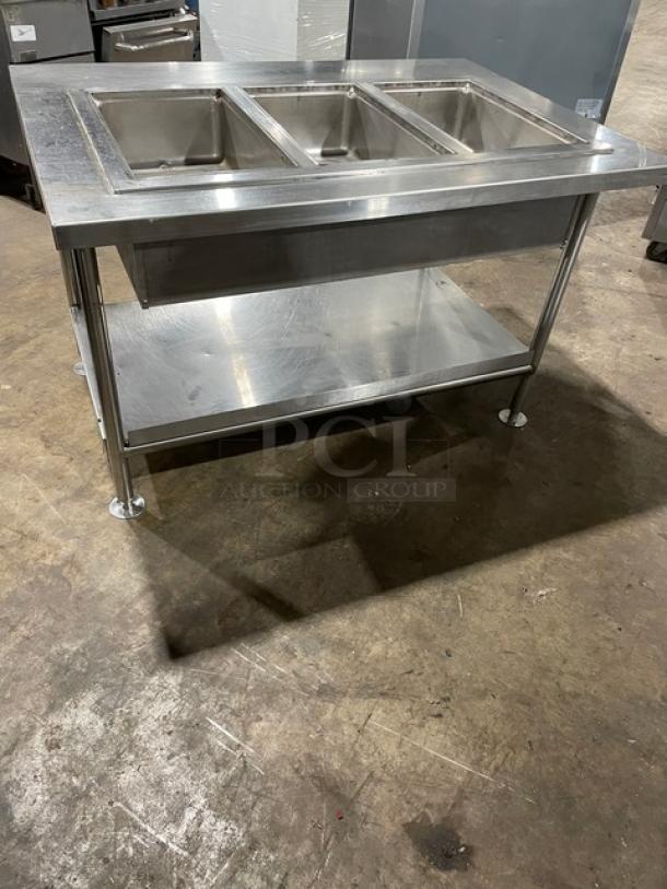 Wells MOD300TDM stainless steel electric 3-well steam table, with single undershelf, on legs, 208/240V, excellent condition.