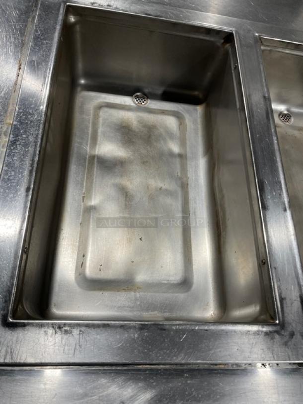 Wells MOD300TDM commercial stainless steel 3-well hot food steam table with undershelf, 208/240V, on legs. Visible wear.