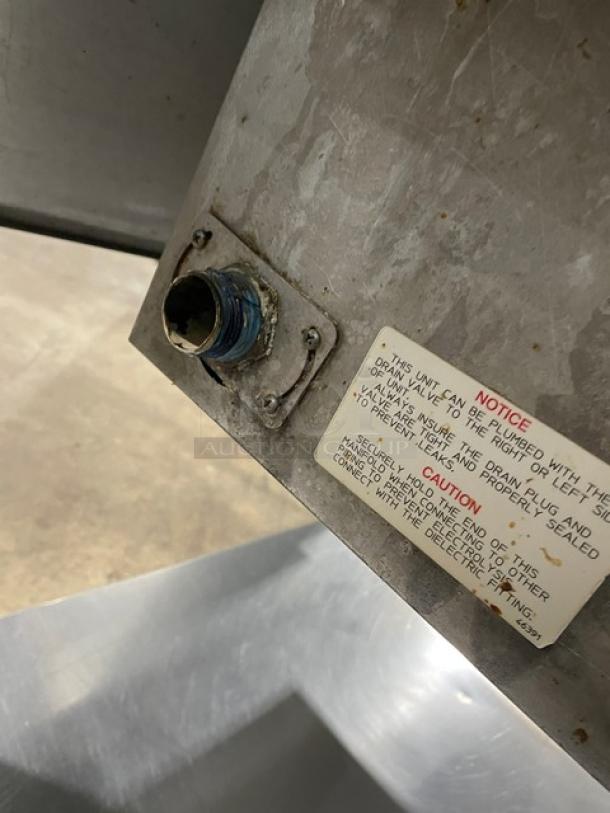 Wells MOD300TDM stainless steel 3-well hot food steamtable with undershelf, 208/240V, model label and power connector visible.