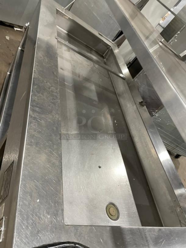 Precision stainless steel refrigerated cold food/salad bar, model SST2024RTNYC, with double overhead shelf and sneeze guard.