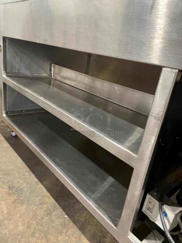 Precision SST2024RTNYC stainless steel refrigerated salad bar, double shelf cabinet base, on casters, excellent condition.