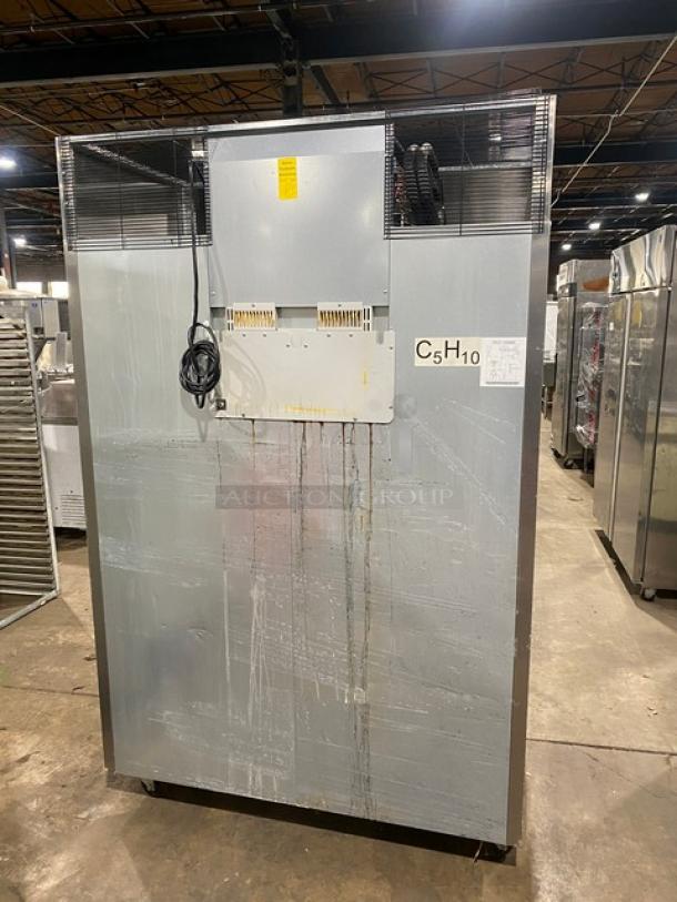 Alt text: Atosa MBF8002GR commercial stainless steel 2-door reach-in freezer, 2020 model, on casters. Back view with energy label.