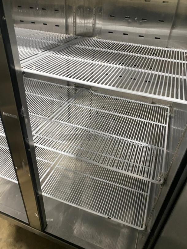 Atosa 2020 Model MBF8002GR commercial stainless steel 2-door reach-in freezer with poly coated racks, on casters.