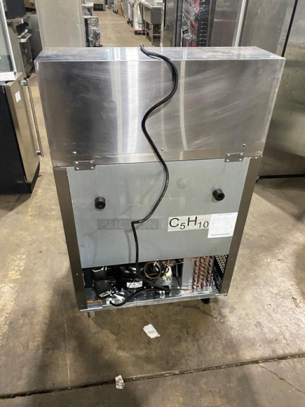 Atosa commercial stainless steel single door refrigerated prep table, bain marie style, with poly coated wire rack and casters.