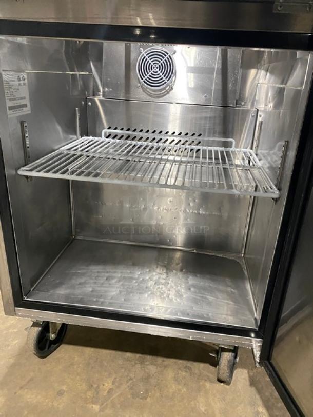 Atosa stainless steel refrigerated prep table with single door, poly coated rack, 115V, on casters, for salad/sandwich use.