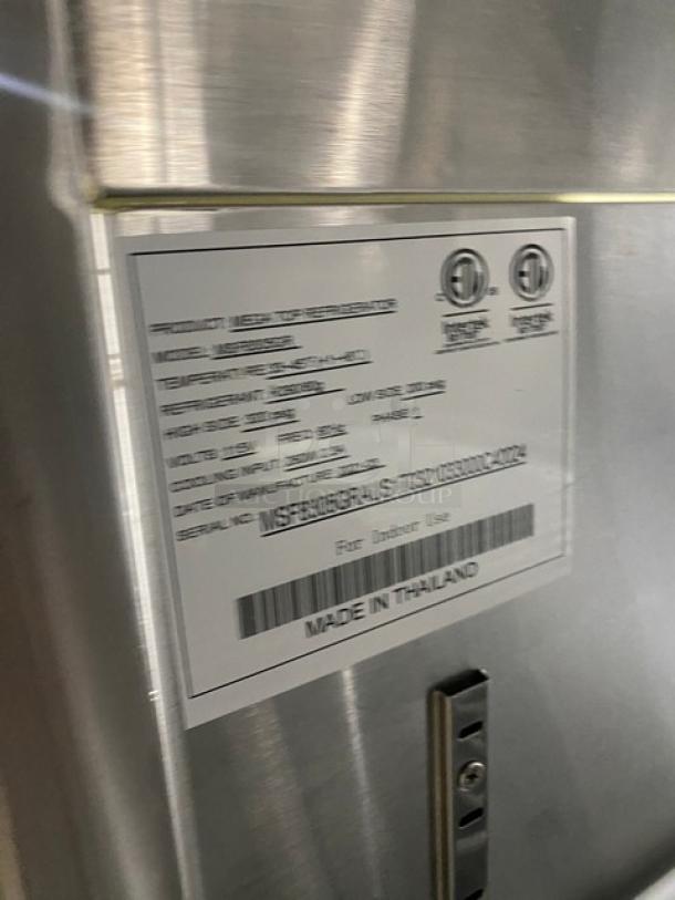 Atosa commercial stainless steel single door prep table, refrigeration unit label visible, 115V, made in Thailand.