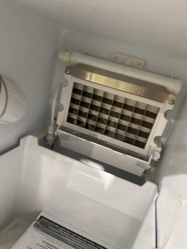 Maxx Ice MIM50 ice maker interior, stainless steel finish, commercial quality, Energy Star certified, model tag visible.