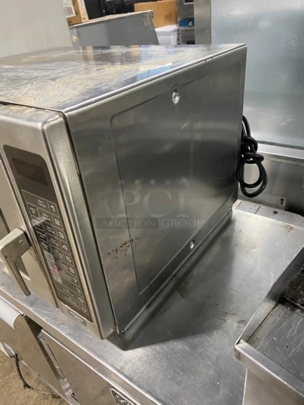Amana RFS12SW2A Commercial Stainless Steel Microwave Oven, 120V, digital controls, minor surface scratches, electric-powered.
