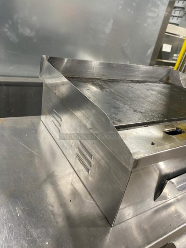Commercial stainless steel electric countertop flat griddle with back and side splash. Used condition.