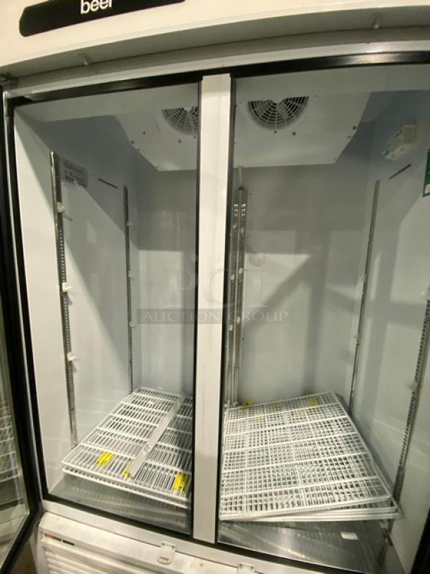 Turbo Air TGM-47SDW double glass door merchandiser refrigerator, Energy Star, poly coated racks, SN: RS47WBY564, on legs.
