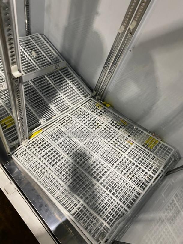 Turbo Air TGM47SDW commercial refrigerator with white double glass swing doors, poly-coated wire racks. Energy Star certified.