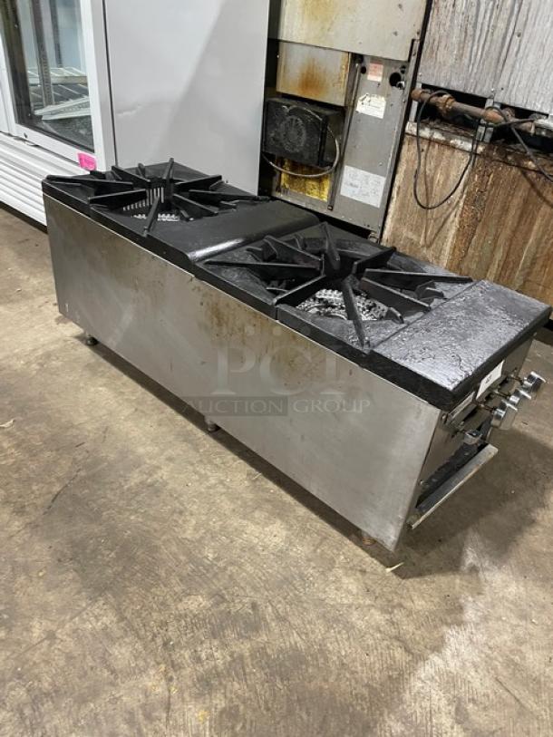 Cookline commercial stainless steel gas-powered double burner stock pot range on legs, slight wear, ideal for high-volume kitchens.