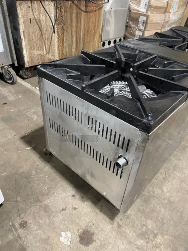 Cookline stainless steel gas-powered double burner stock pot range on legs. Visible knobs, sturdy grates, used condition.