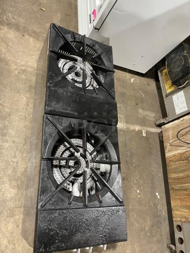 Cookline stainless steel gas-powered double burner stock pot range, on legs, commercial-grade. Shows minimal wear.