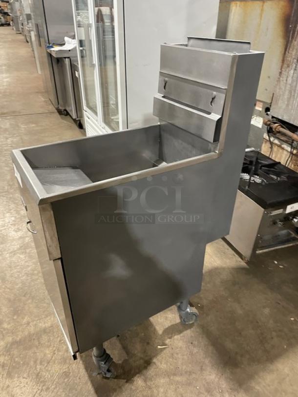 Pitco 40DSM stainless steel, 40 lb. natural gas fryer; includes back splash, basket hanger; on casters; model SN: G16DA025309.