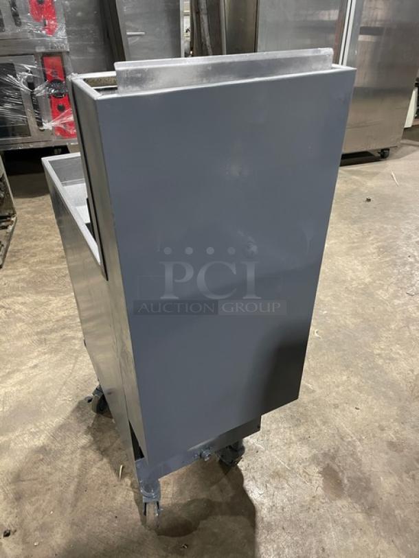 Pitco 40DSM stainless steel natural gas-powered deep fat fryer with backsplash and basket hanger, on casters. Model: 40D-SM.