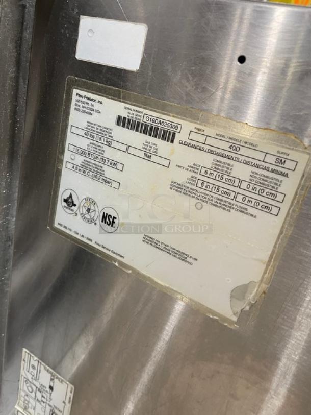 Pitco 40DSM stainless steel natural gas fryer, 40 lb capacity, model: 40D-SM, serial: G16DA025309, with backsplash, basket hanger, on casters.