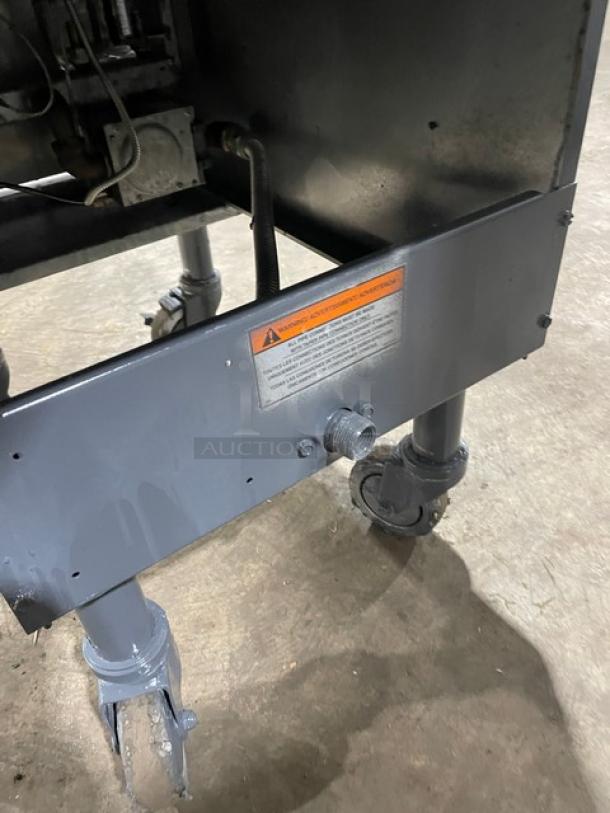 Pitco Commercial 40D-SM deep fat fryer, stainless steel, natural gas powered, 40 lb capacity, with back splash, basket hanger, on casters, visible warning label.