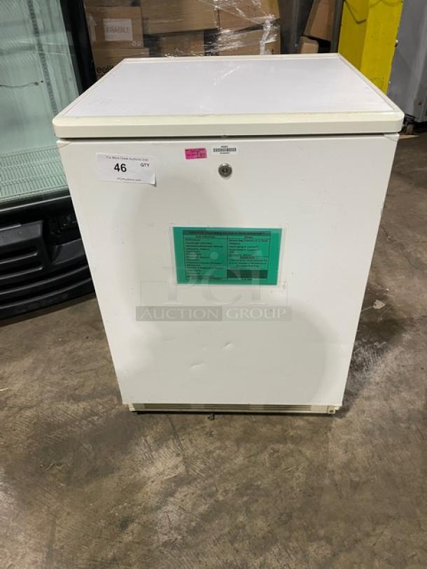 Fisher Scientific white single-door undercounter flammable materials storage unit, model 979381, with poly-coated wired rack.