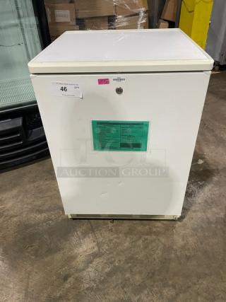 Fisher Scientific white single-door undercounter flammable materials storage unit, model 979381, with poly-coated wired rack.