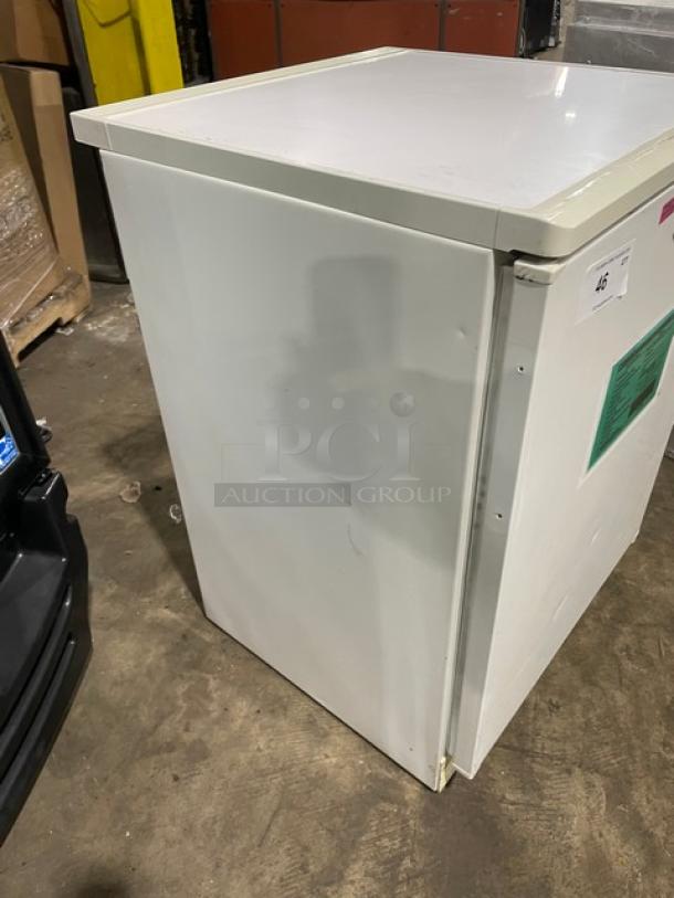 Fisher Scientific Model 979381 undercounter flammable materials storage unit, white, single door, poly coated wired rack.