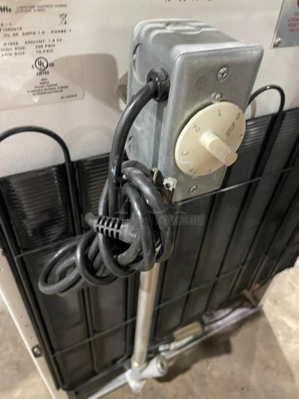 Fisher Scientific flammable materials storage unit, model 979381, with poly-coated rack, 120V, 1 phase, SN: 1422071080575.