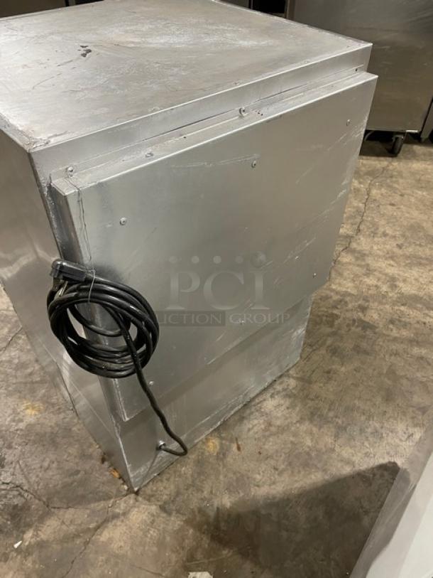 Glastender 2018 stainless steel countertop mug chiller/froster, Model MFV24GNL, with black powder coat, cord attached.