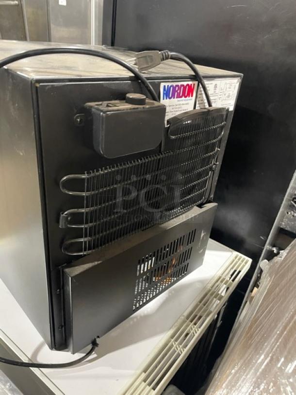 Nordon commercial black glass door countertop merchandiser refrigerator, model SC52, 120V, with poly coated wired rack.
