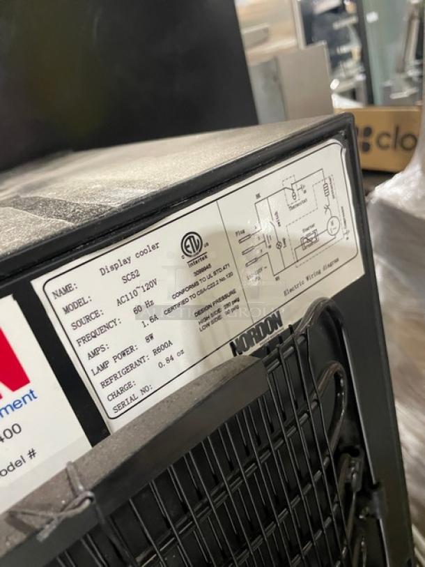 Nordon SC52 commercial black single glass door countertop merchandiser refrigerator, poly-coated wired rack, 120V, ETL certified.