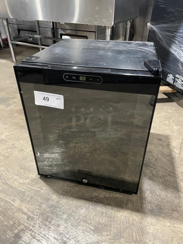 Schmecke 12-bottle wine cooler with black single glass door and chrome plated wired rack, model number visible.