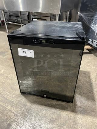 Schmecke 12-bottle wine cooler with black single glass door and chrome plated wired rack, model number visible.