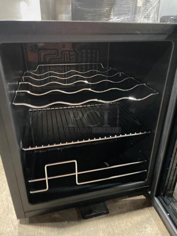 Schmecke commercial wine cooler, black, single glass door, holds 12 bottles, chrome-plated wire rack, 115V, excellent condition.