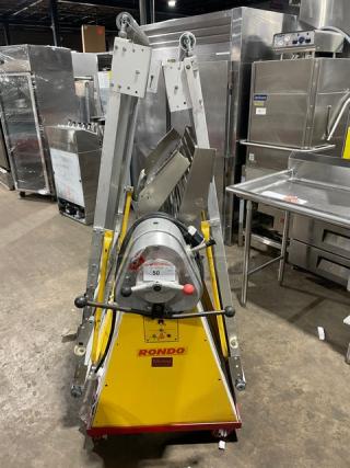 Seewer Rondo SS064C electric dough sheeter with fold-up conveyor belt, on casters. Model: SS064C, SN: A6019004, yellow.