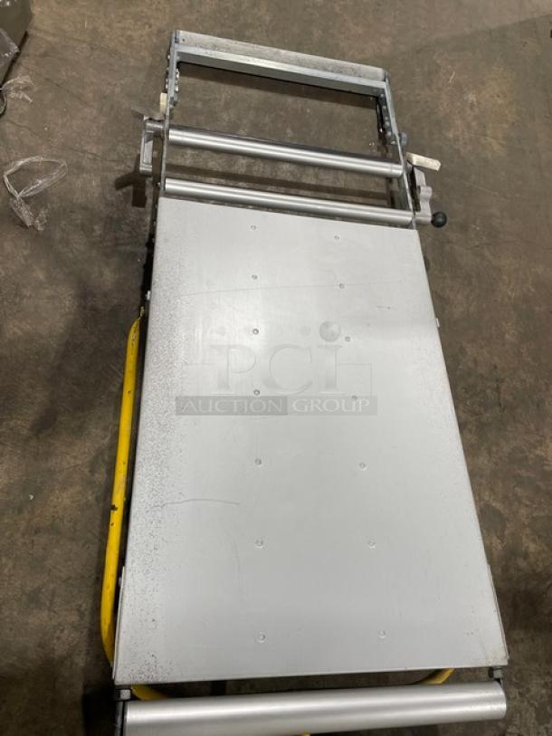 Seewer Rondo SS064C commercial dough sheeter with fold-up conveyor, on casters. Electric powered, reversible model.