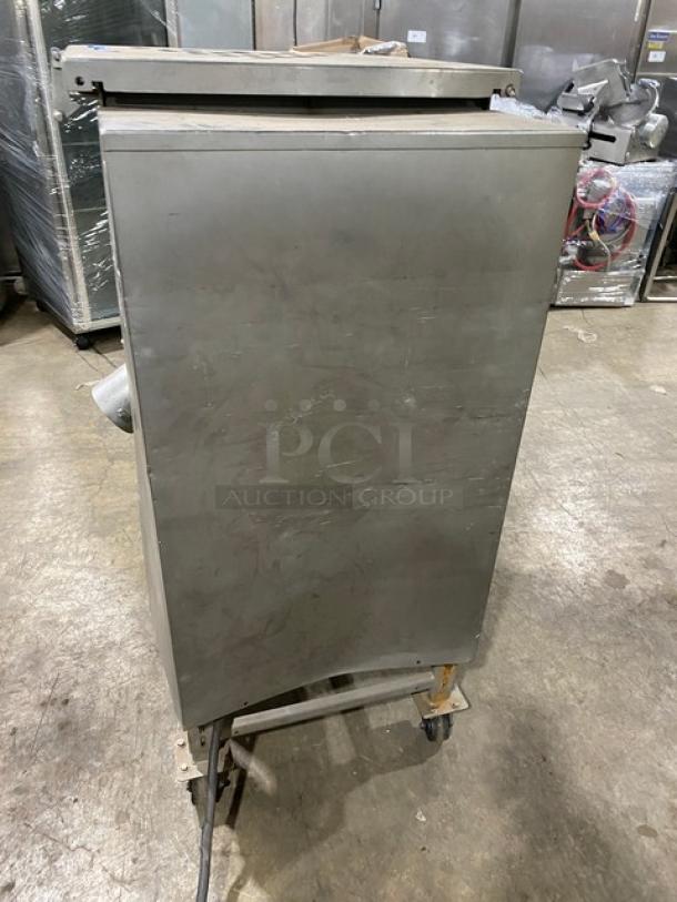 Biro commercial stainless steel meat mixer/grinder with electric power, heavy-duty, free-standing, on casters.