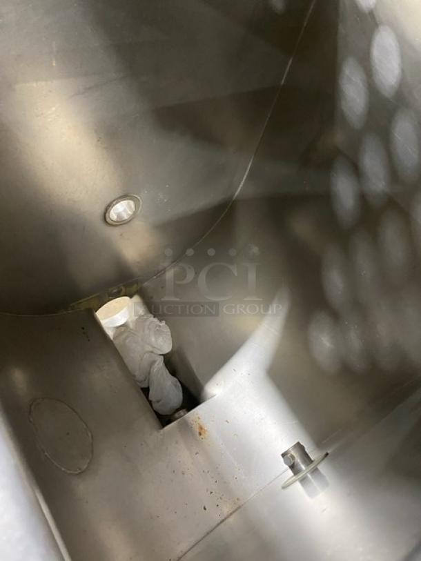 Biro commercial stainless steel meat mixer/grinder interior, showing clean metal finish. Electric-powered, on casters.